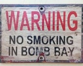 NO smoking in bomb-bay  sign made from reclaimed plywood