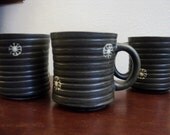 Mid century vintage rustic green grey brown mugs with a white wheel sand dollar like shape design
