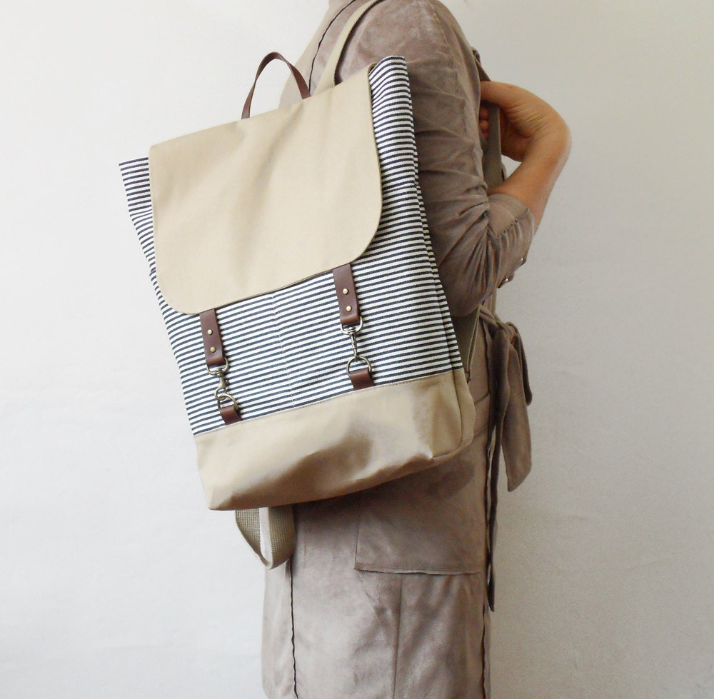1 LEFT, Red hound navy denimwool  backpack with leather closure and 2 front pockets, featured on FRANKIE,  Design by BagyBags
