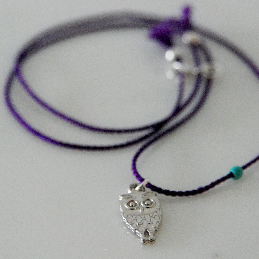 Silver plated owl necklace with purple silk cord
