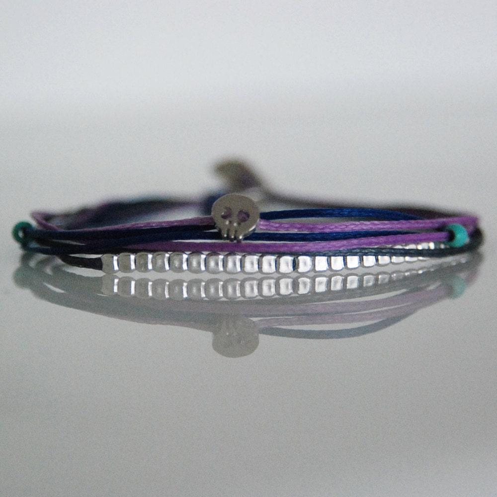 Layered skull bracelet with hammered silver beads