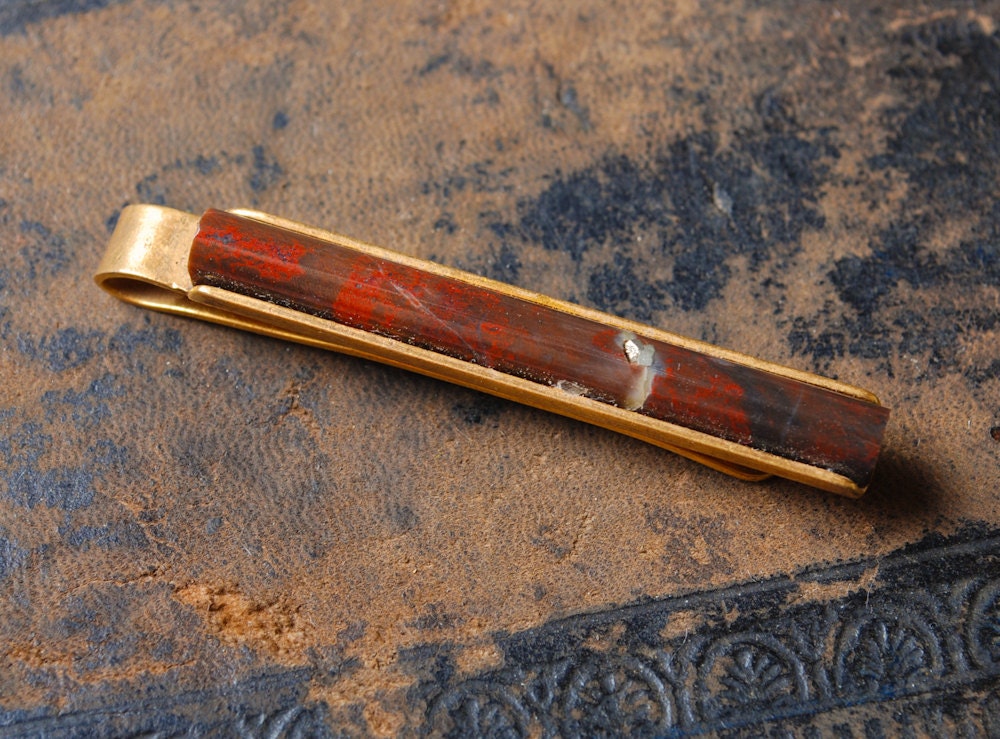 Vintage brass tie bar clip with gemstone.