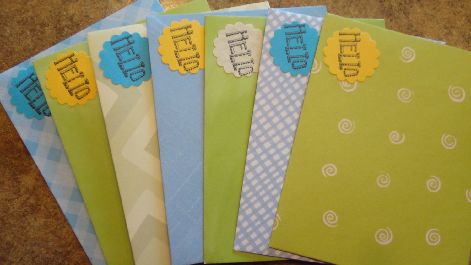 7 assorted green and blue toned handmade envelopes