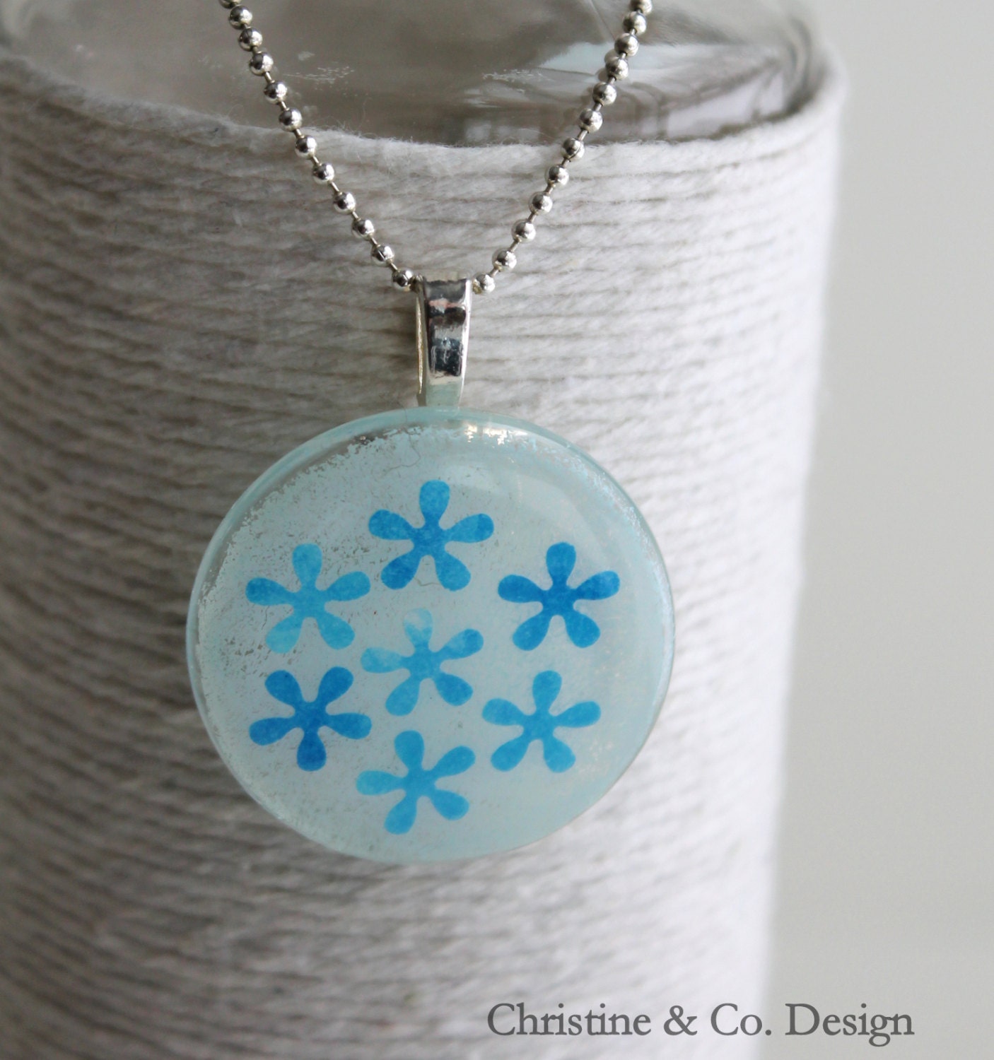 Blue Flowers on a Round Glass Pendant