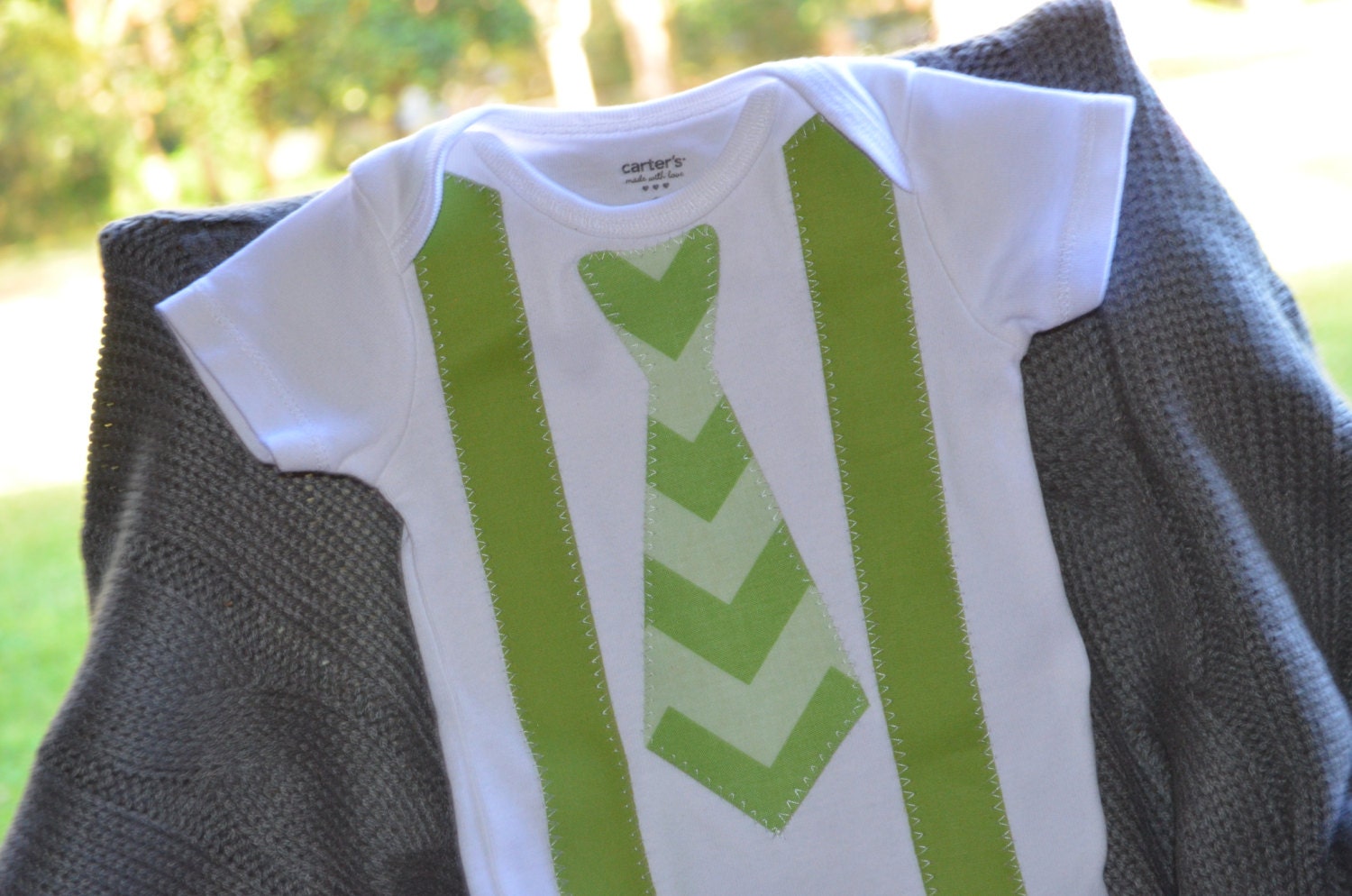 Reserved Gray onesie 12M with Green Chevron pictured here with suspenders and tie