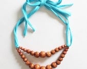Color Pop Necklace in Hazelnut & Aqua . Non-toxic Beads with a Jersey Tie . Fashionable and baby-friendly