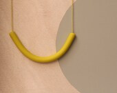 not quite a semi circle makes a necklace