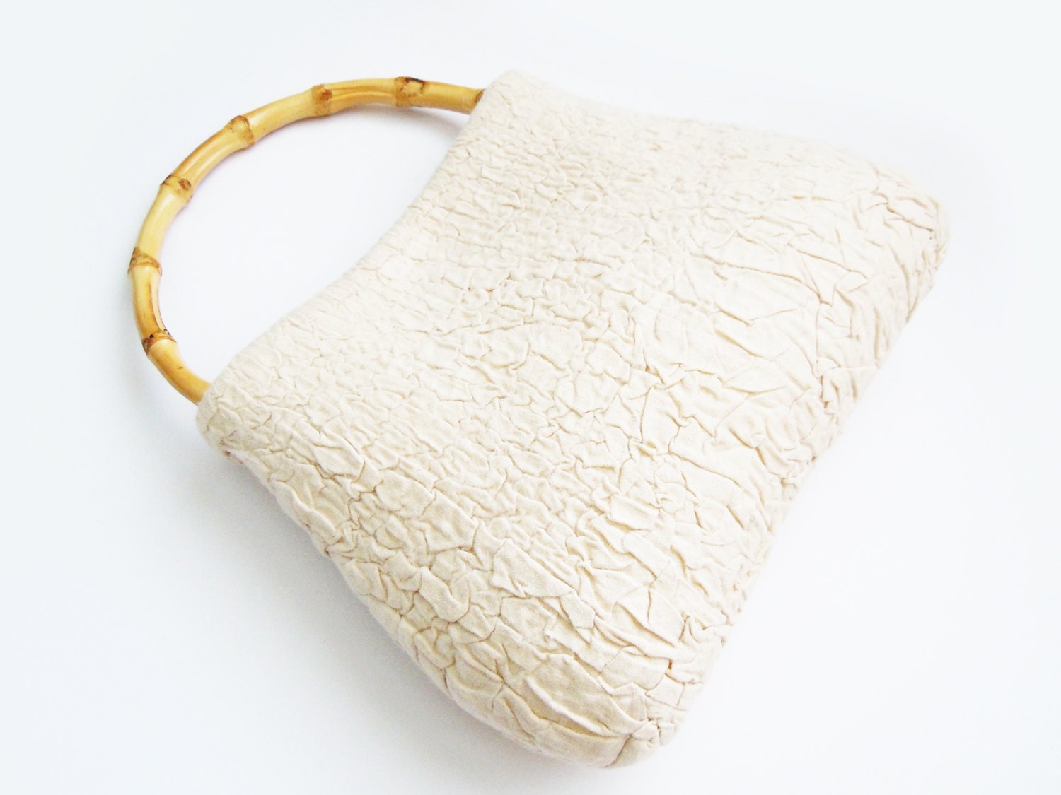 Felted handbag with bamboo handle.