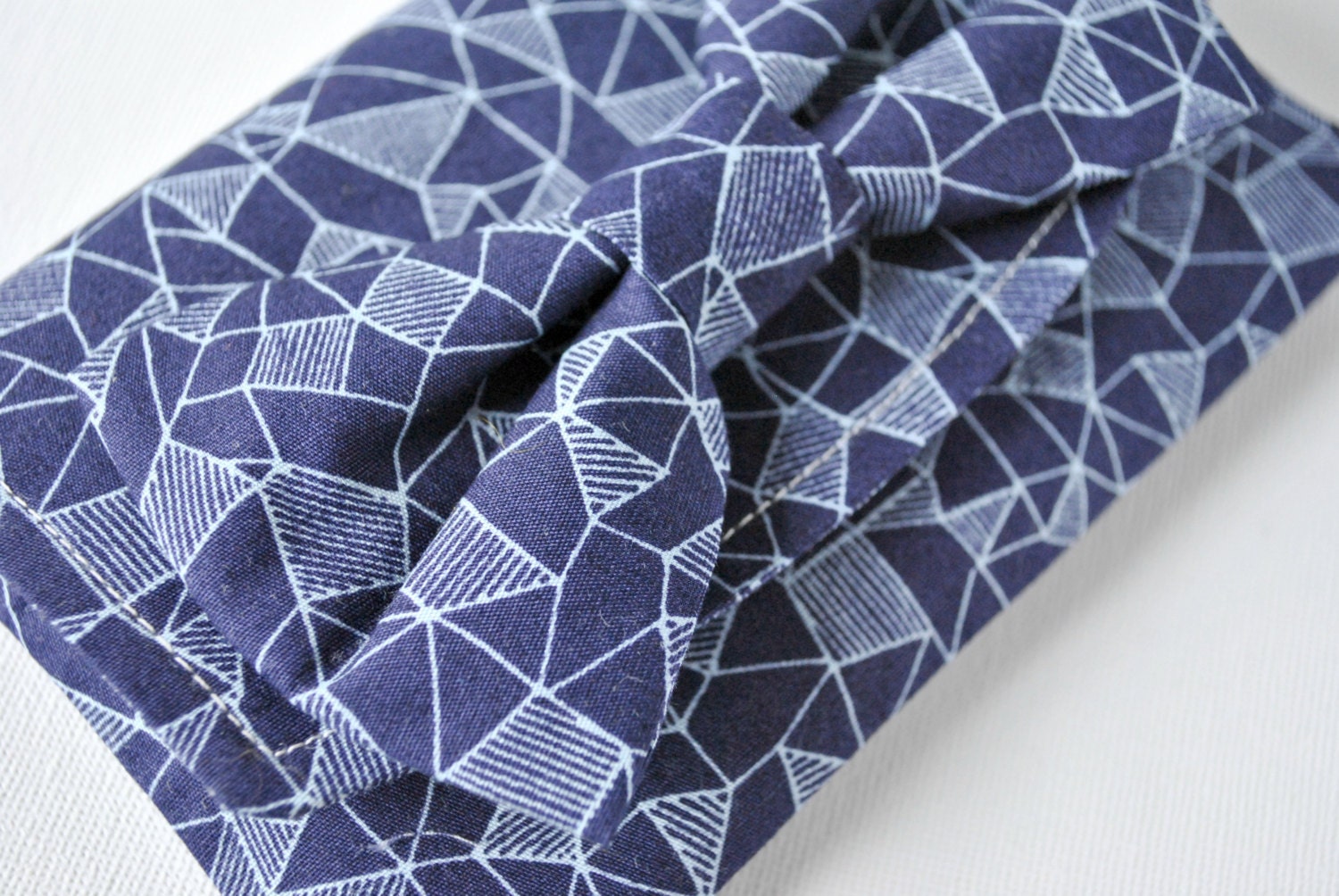 pouch purse wallet: Abstract hand drawn triangle shapes print in light blue and navy with bow.