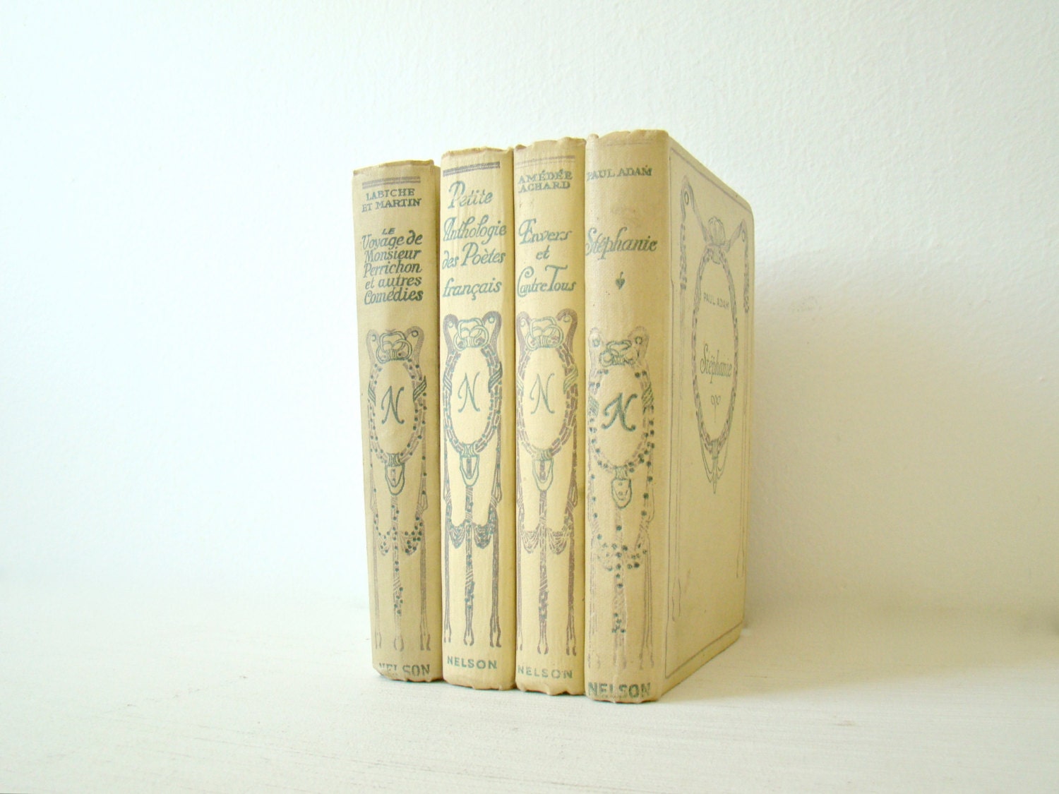 Lovely wedding decor, neutral summer shades, beach decorating, Nelson collection, 1930s, pale yellow french books, spring books