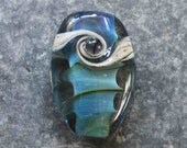 Handmade lampwork focal bead 'Iridescent blues'.  SRA