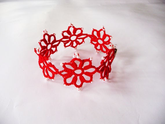 Handcrafted red bracelet  with beads.