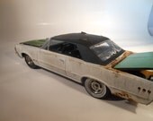1965 Pontiac GTO 1/24 scale model car in white with an olive hood