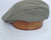 Hand crafted Golf cap, durable cotton top, snap front visor, fully lined with supple leather sweatband.