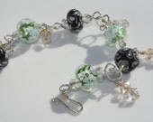 Green, Black and White Flower Lampwork Glass Sterling Silver Bracelet with Crystal Charms