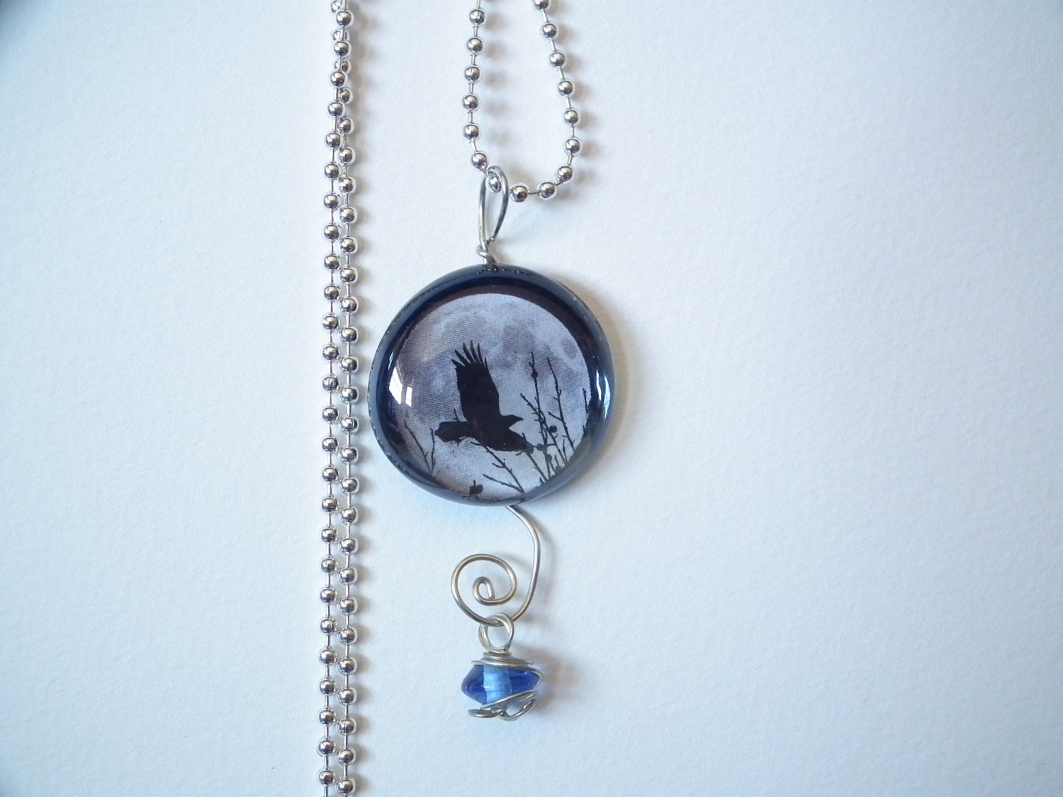 Unique pendant with silver wire and colored dangle, moon flying crow, raven black white, grey, gothic, Poe, 1 inch, ball chain, glass, photo