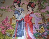 Two Geisha in a Garden strechted and ready to hang cross-stitch