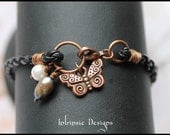 Single Plaited Leather and Charm Bracelet with Butterfly and Pearls in Copper