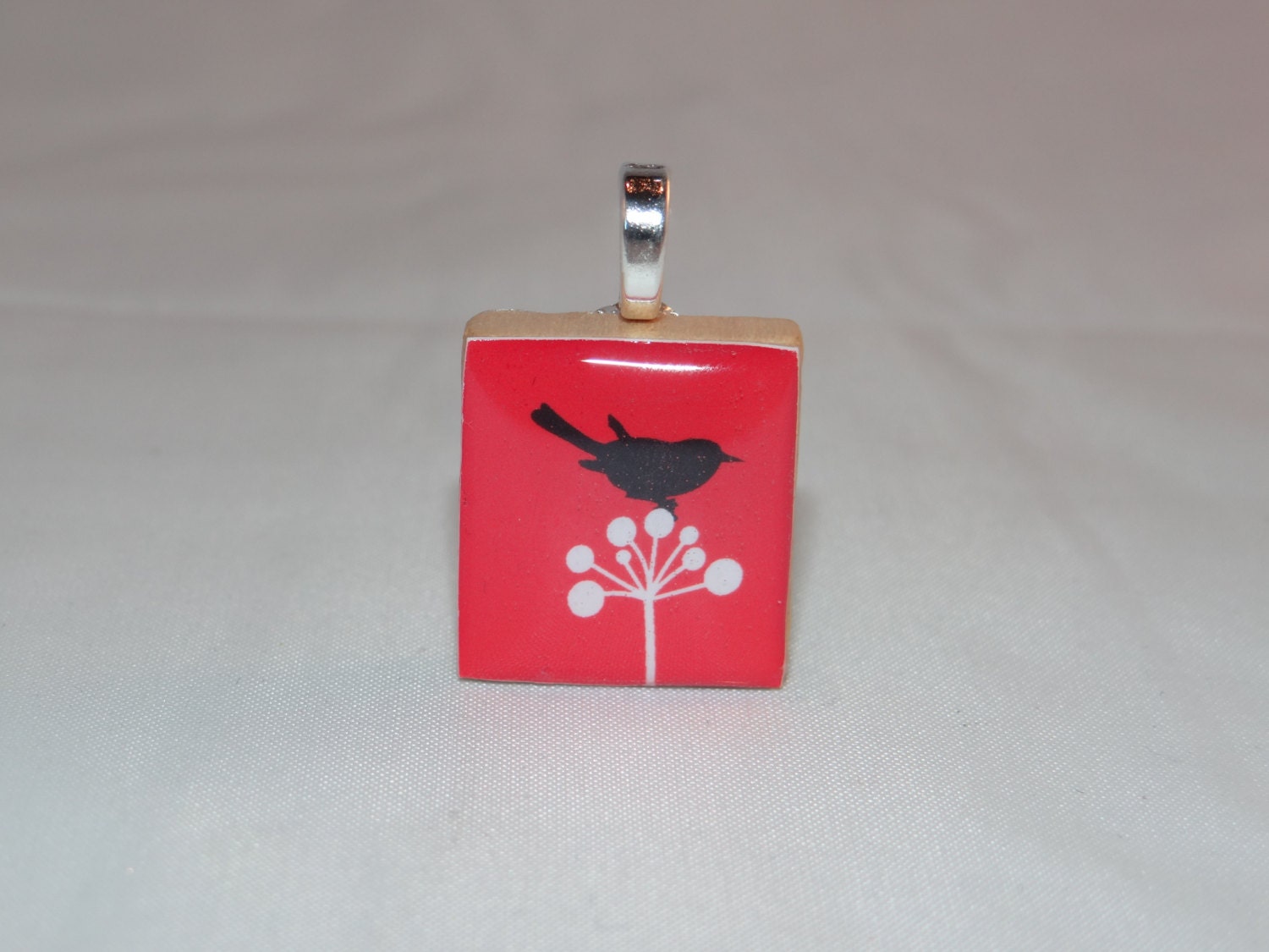 Red Black and White bird pendant