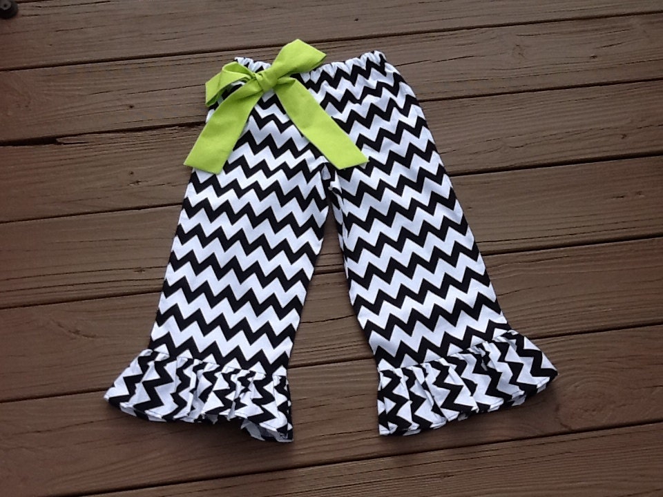 Girls ruffle pants & lime green fabric bow. Mod black white chevron zig zag. Custom children's clothing. By EverythingSorella.