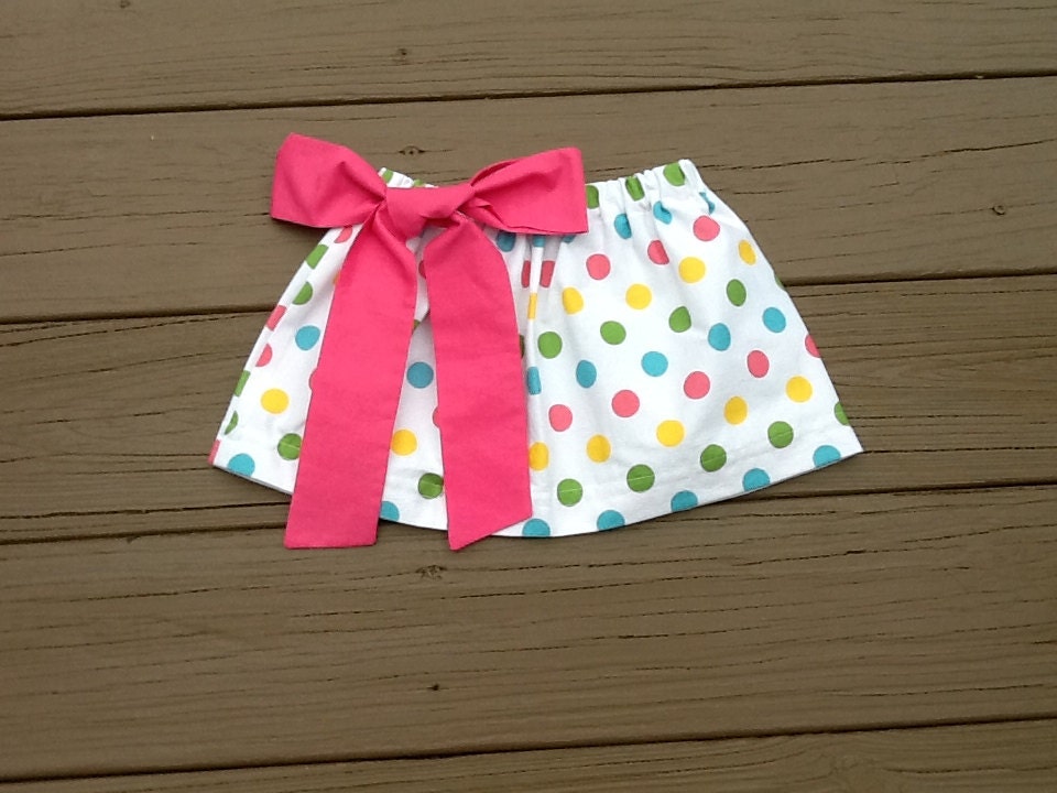 Girls twirly skirt & hot pink fabric bow. Mod girls multicolor polka dot. Custom boutique children's clothing. By EverythingSorella.
