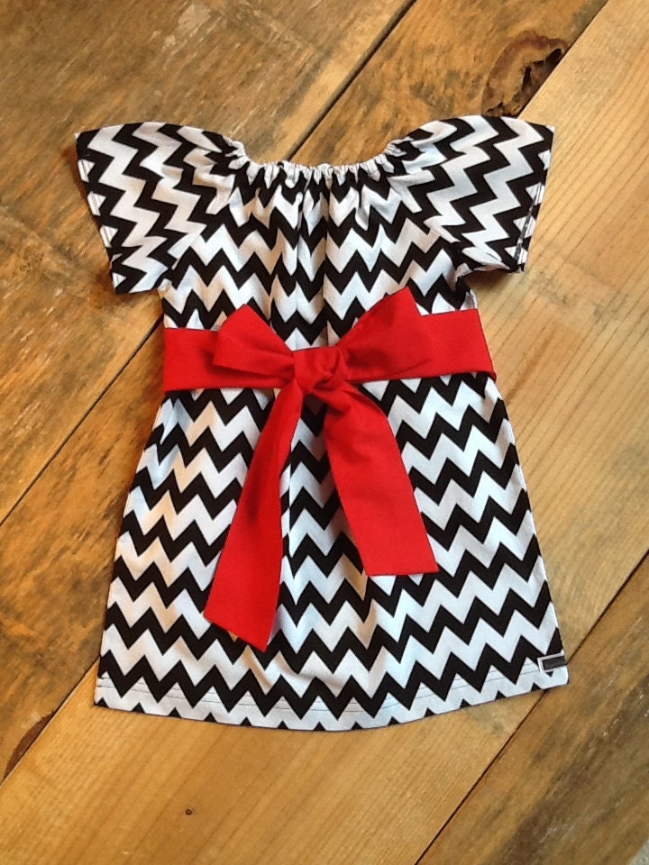 Girls Little Peasant Dress with fabric bow detail. Black white or any chevron fabric.  Custom children's clothing. By EverythingSorella