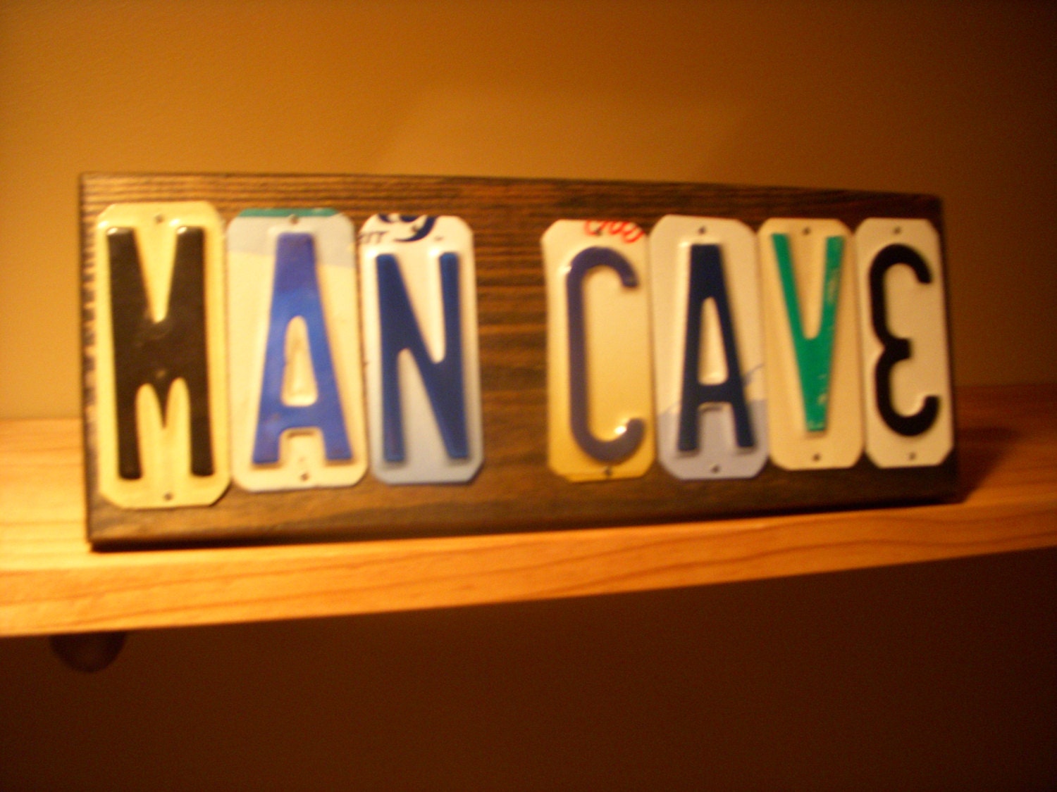 MAN CAVE sign made with license plates.