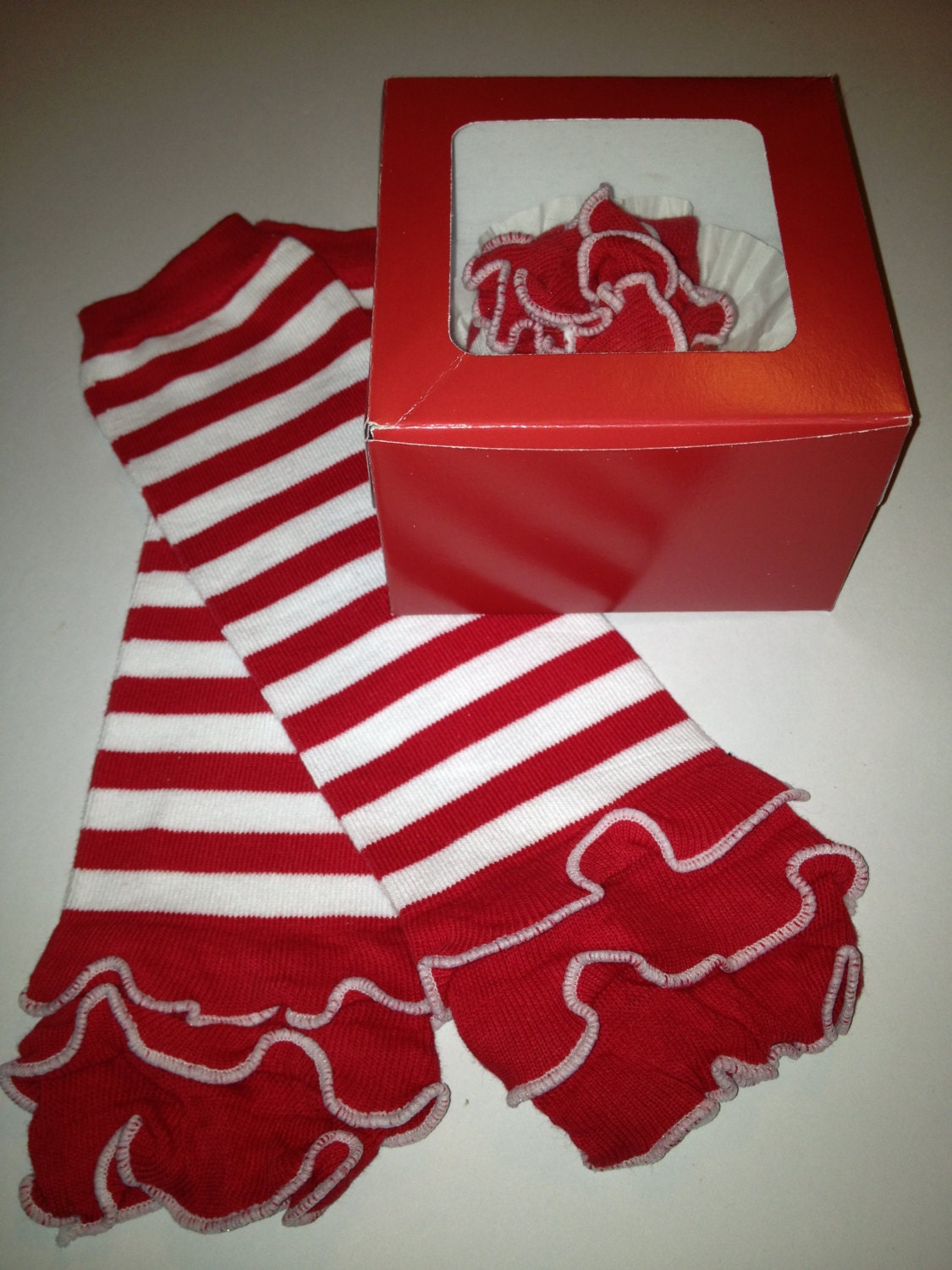 Holiday Red and White Candy Cane Striped Valentines Day Leg Warmers with Ruffle Packaged like a Cupcake