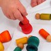 Montessori inspired matching game with peg dolls and cups