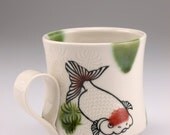 Goldfish mug with green dots