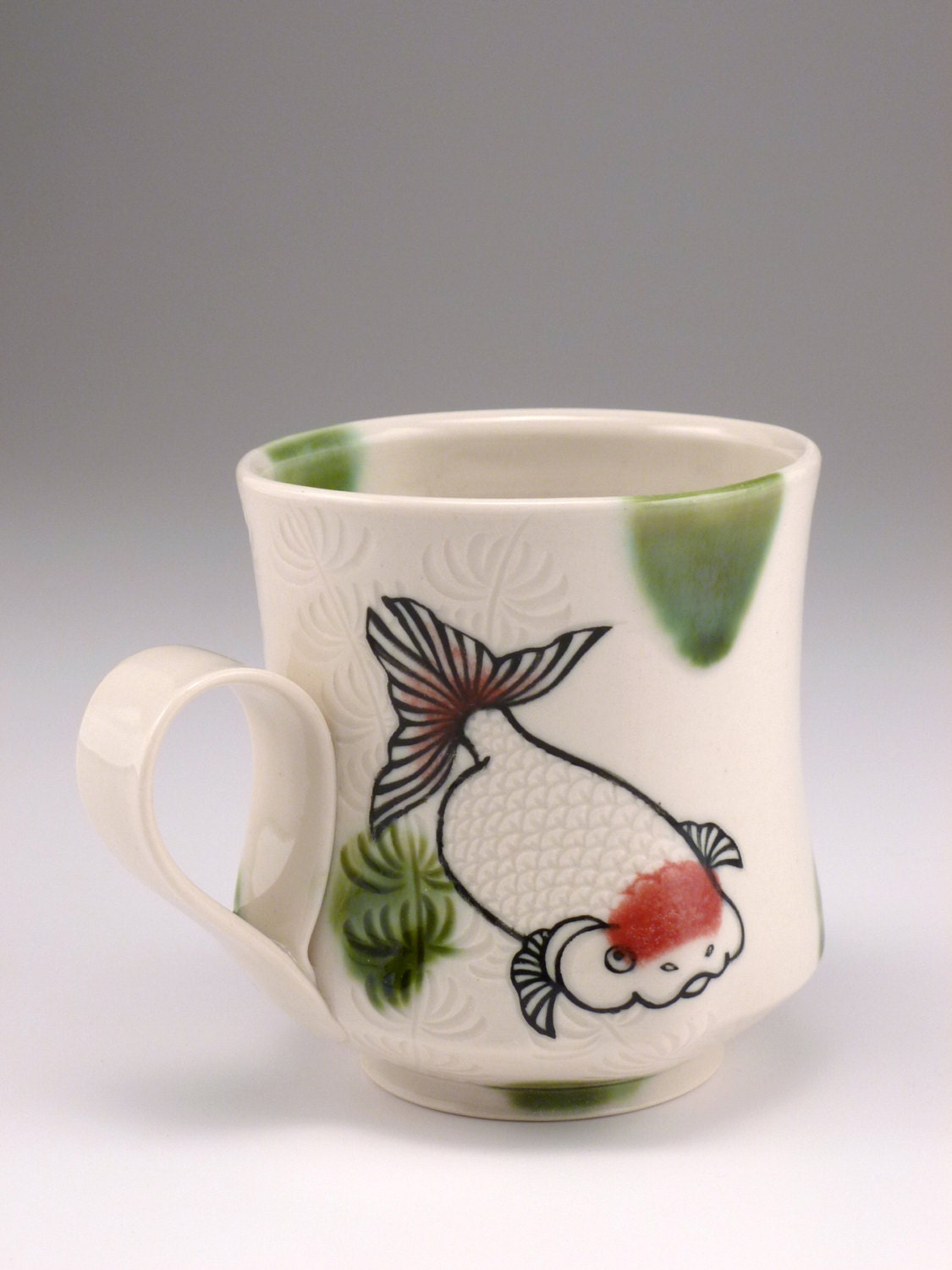 Goldfish mug with green dots