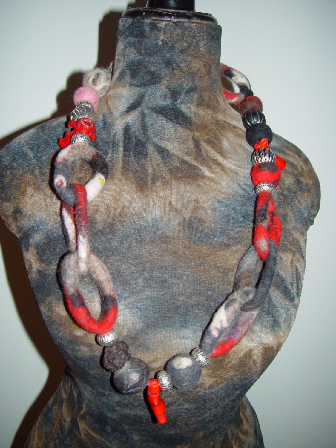 Handcrafted necklace made of felted merinowool combined with  beads from Africa