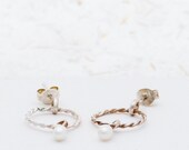 Silver of golden earrings with a pearl