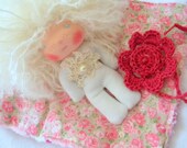 Fedora is a beautiful little 5 inches  Waldorf doll with blanket and flower.