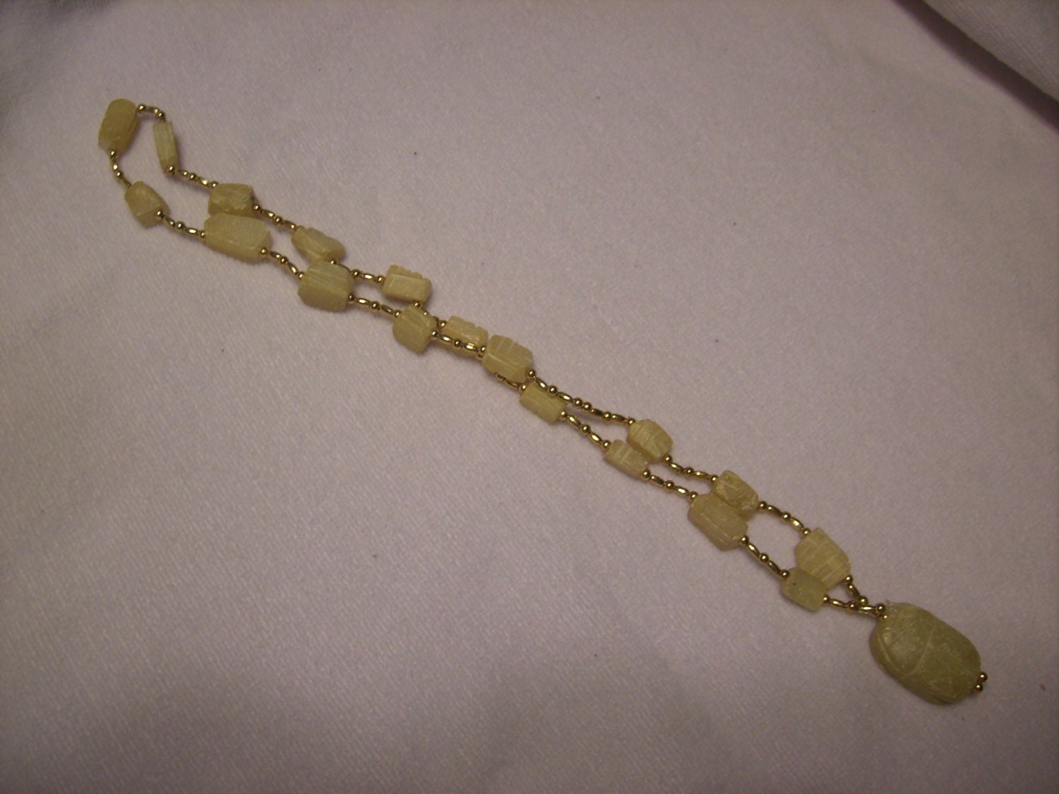 Egyptian revival art deco scarab necklace. multiple scarabs with gold colored beads