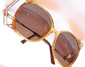 Fantastic Dior Vintage oversized sunglasses with gold-flecked amber frames and gold cage details