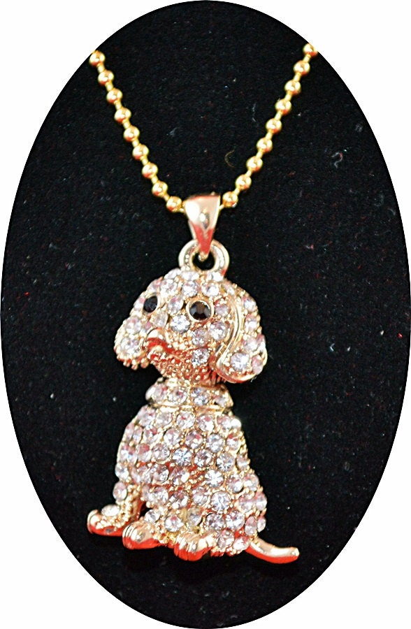 This Cute Golden Puppy Pendant is Encrusted by Rhinestones and Suspended by a Gold Plated Ball Chain