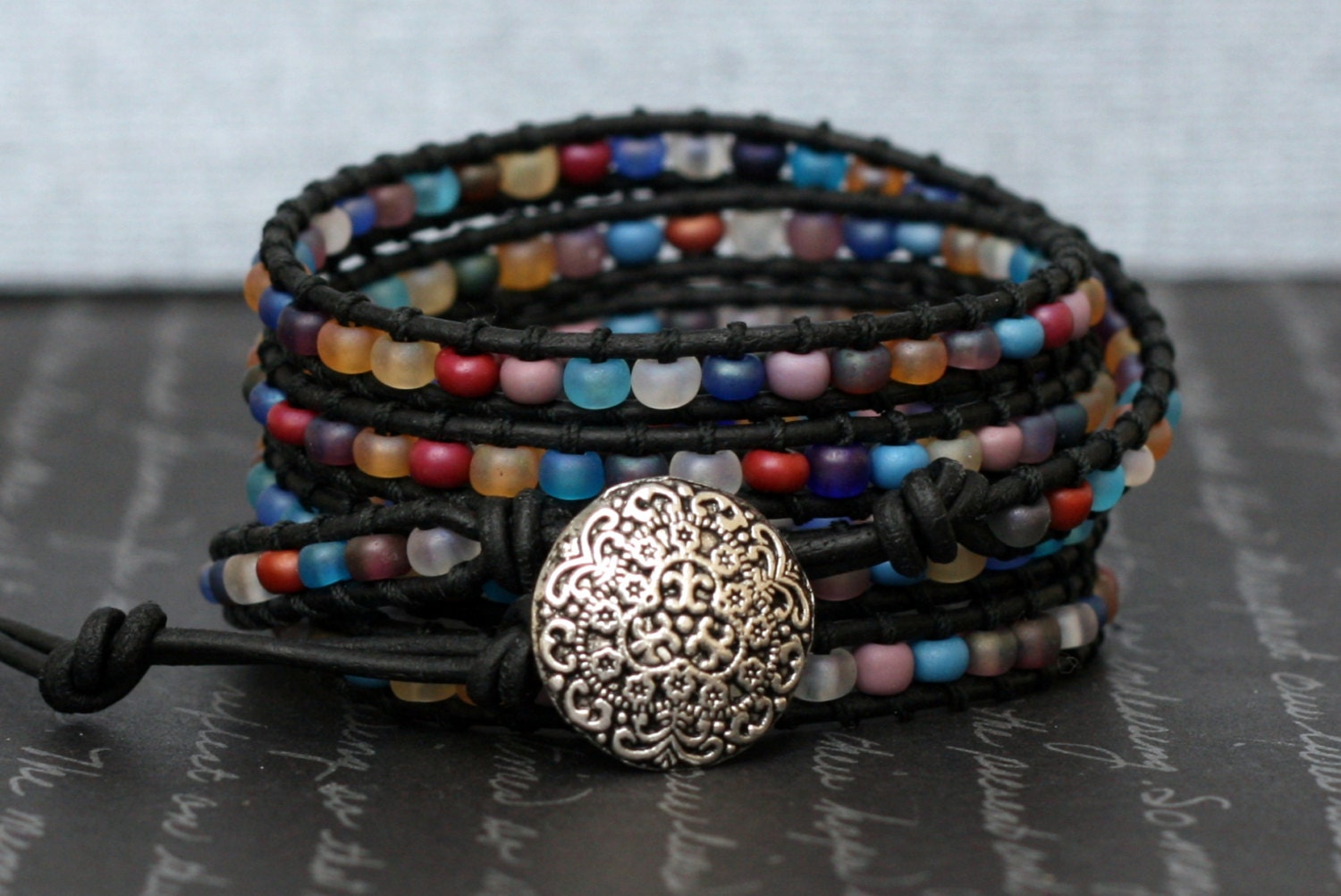 wrap bracelet- frosted glass beads on black leather- multicolor
