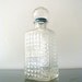 o o o Wine Glass Decanter with tiny triangle pattern and blue rimmed ball glass lid