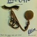 Vintage 1950s "Love Cuffs" gold tone sweater brooch pin collectible