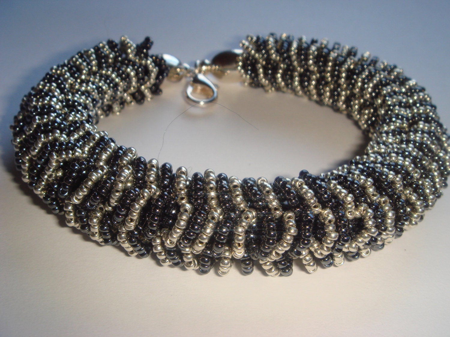 Handmade beaded spirals bracelet. Black and silver bracelet. Tubular bracelet.