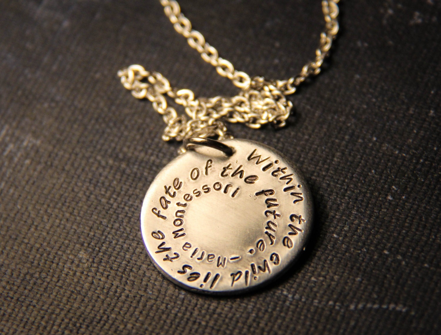 Maria Montessori: "Within the child lies the fate of the future" hand stamped pendant