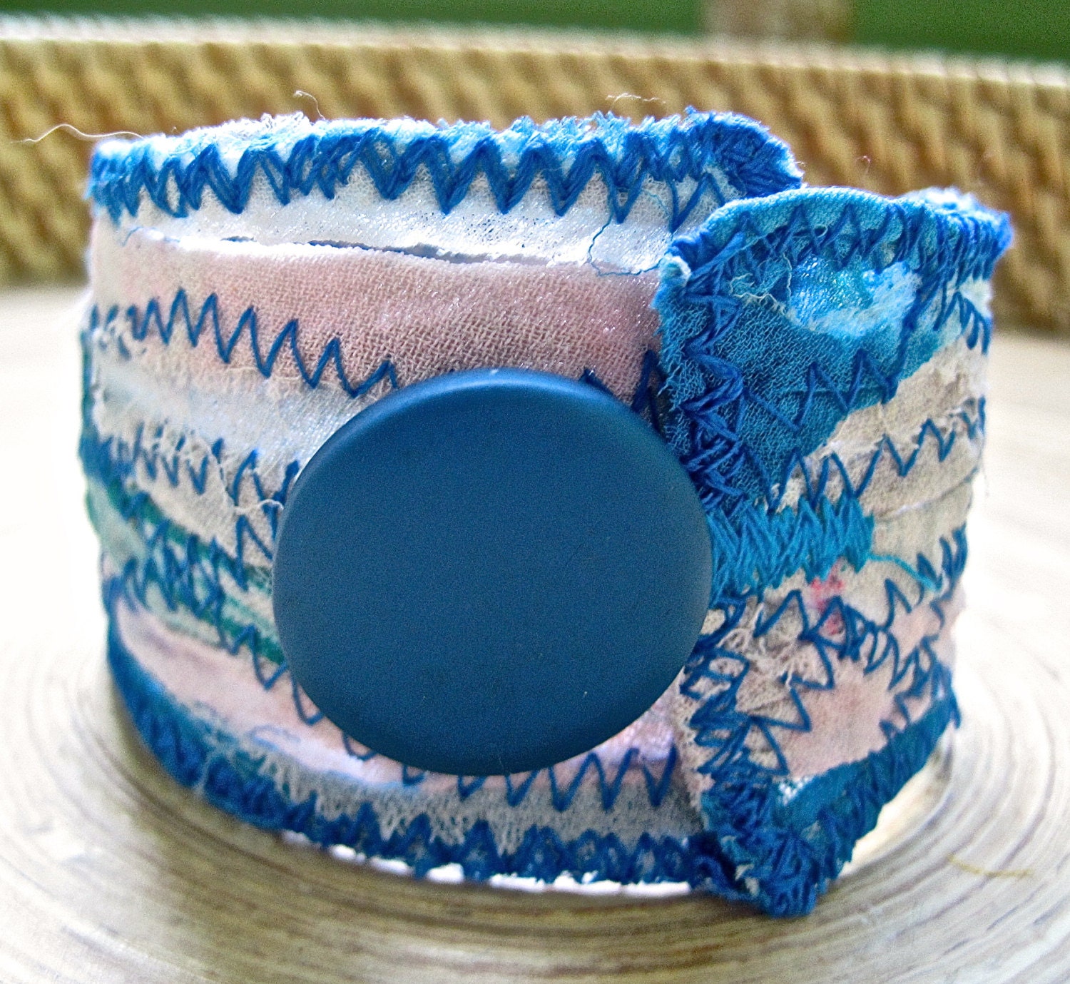 blue and white recycled fabric cuff w/ blue wooden button