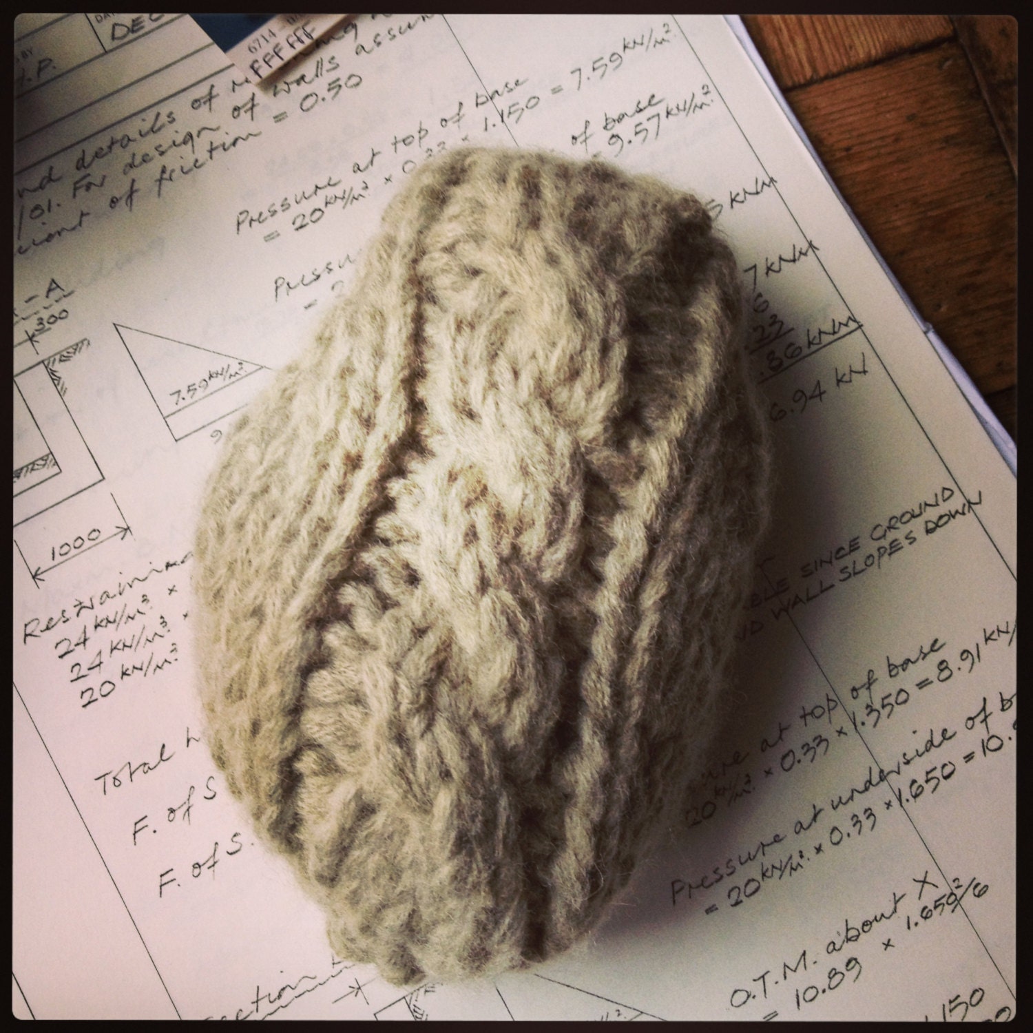 Wool cable knitted paperweight. Hand knitted in bamboo yarn. Unique office accessory.