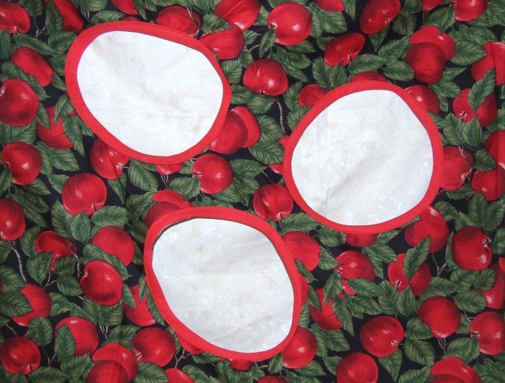 Handmade cotton sack with three circle shaped holes to send a ball. A joyful game for kids. Fun Red Apples.