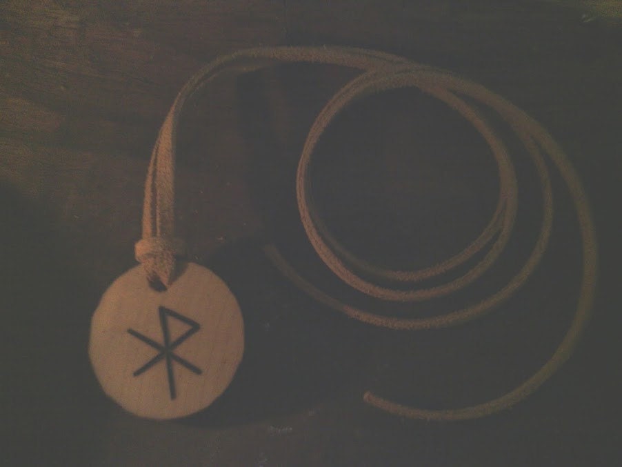 Love bindrune pendant made from recycled wood.