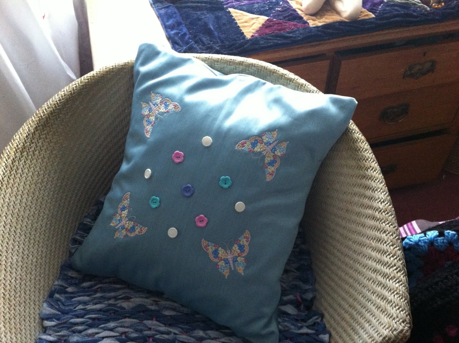 Unique butterflies and button trim pale blue cushion pillow made from recycled fabric