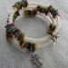 Elegant coiled silver wire wrapped around memory wire bracelet with noblest multicolor sea coral irregular gems loose beads