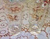 Two golden wheat gold rimmed vintage drinking glasses