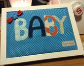 Baby Applique quilted wall hanging in Solid white wood frame complete with hanging hook and shelf stand